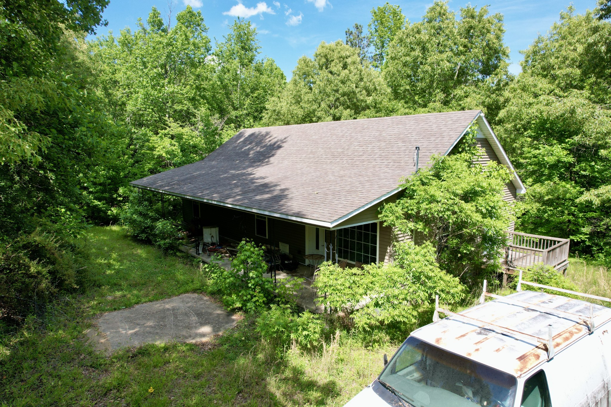 228 Henryville Road Ethridge, TN 38456 - Photo 4 of 55 a view of a backyard with plants and a patio