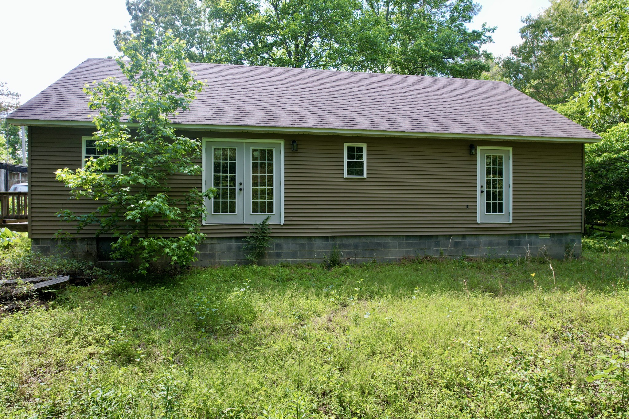 228 Henryville Road Ethridge, TN 38456 - Photo 8 of 55 a front view of a house with a garden