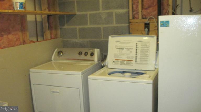 11316 Rawhide Road Lusby, MD 20657 - Photo 13 of 29 a utility room with dryer and washer