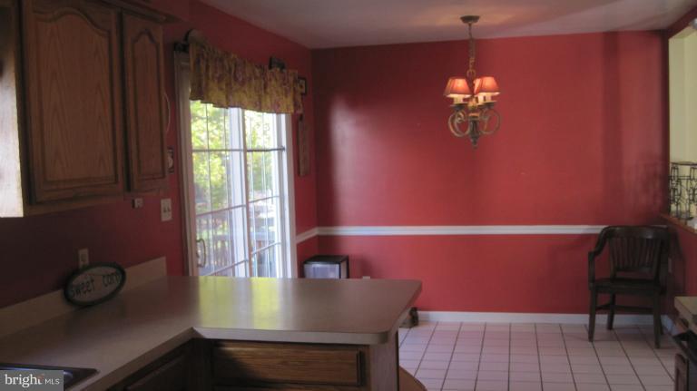 11316 Rawhide Road Lusby, MD 20657 - Photo 14 of 29 a view of a workspace with furniture and window