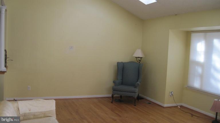 11316 Rawhide Road Lusby, MD 20657 - Photo 25 of 29 a bench sitting in a room next to a window