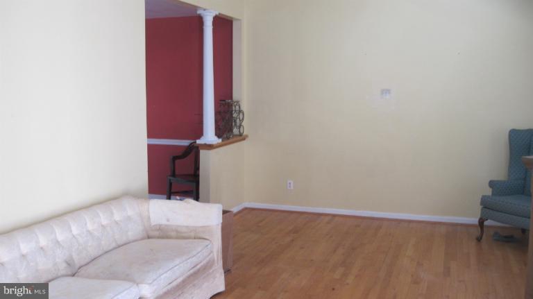 11316 Rawhide Road Lusby, MD 20657 - Photo 8 of 29 a living room with furniture and a potted plant