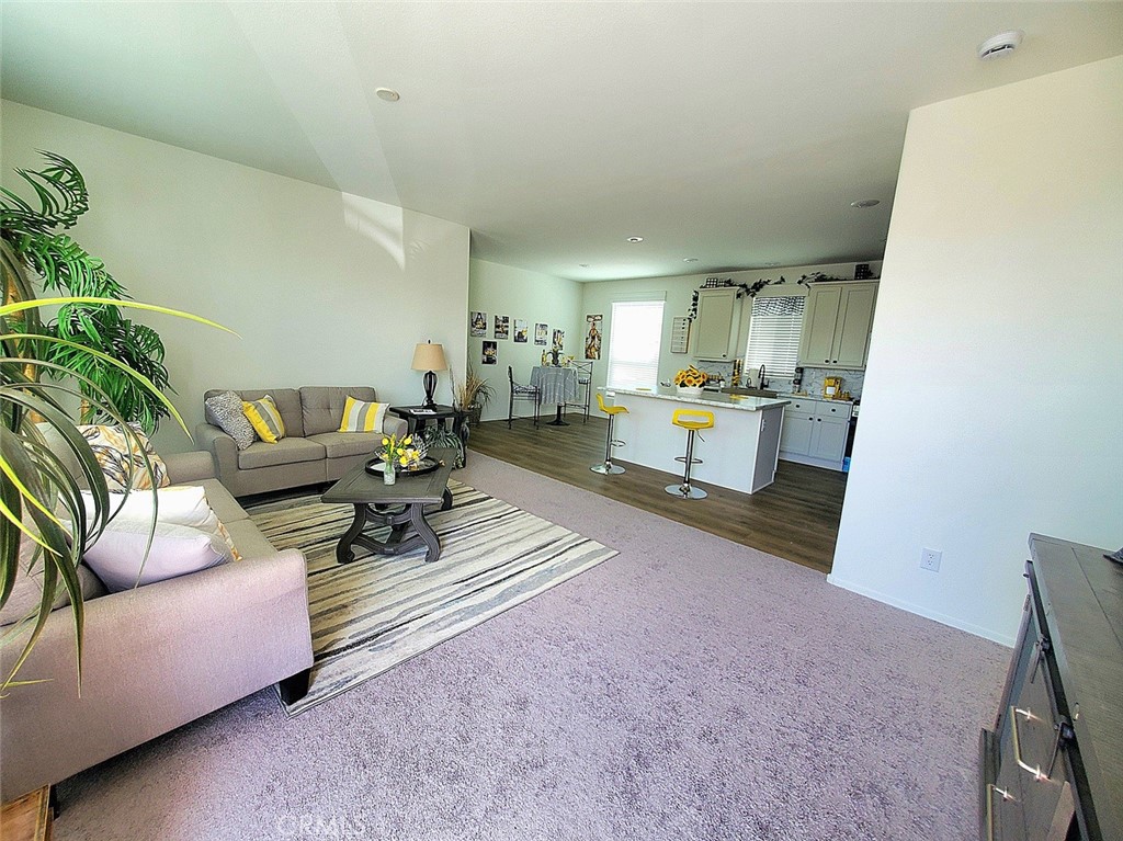 21621 Sandia Road, Unit 138 Apple Valley, CA 92308 - Photo 4 of 38 a living room with furniture and a couch