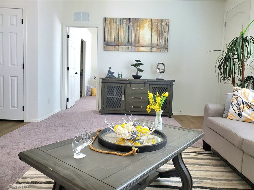 21621 Sandia Road, Unit 138 Apple Valley, CA 92308 - Photo 5 of 38 a living room with furniture and wooden floor