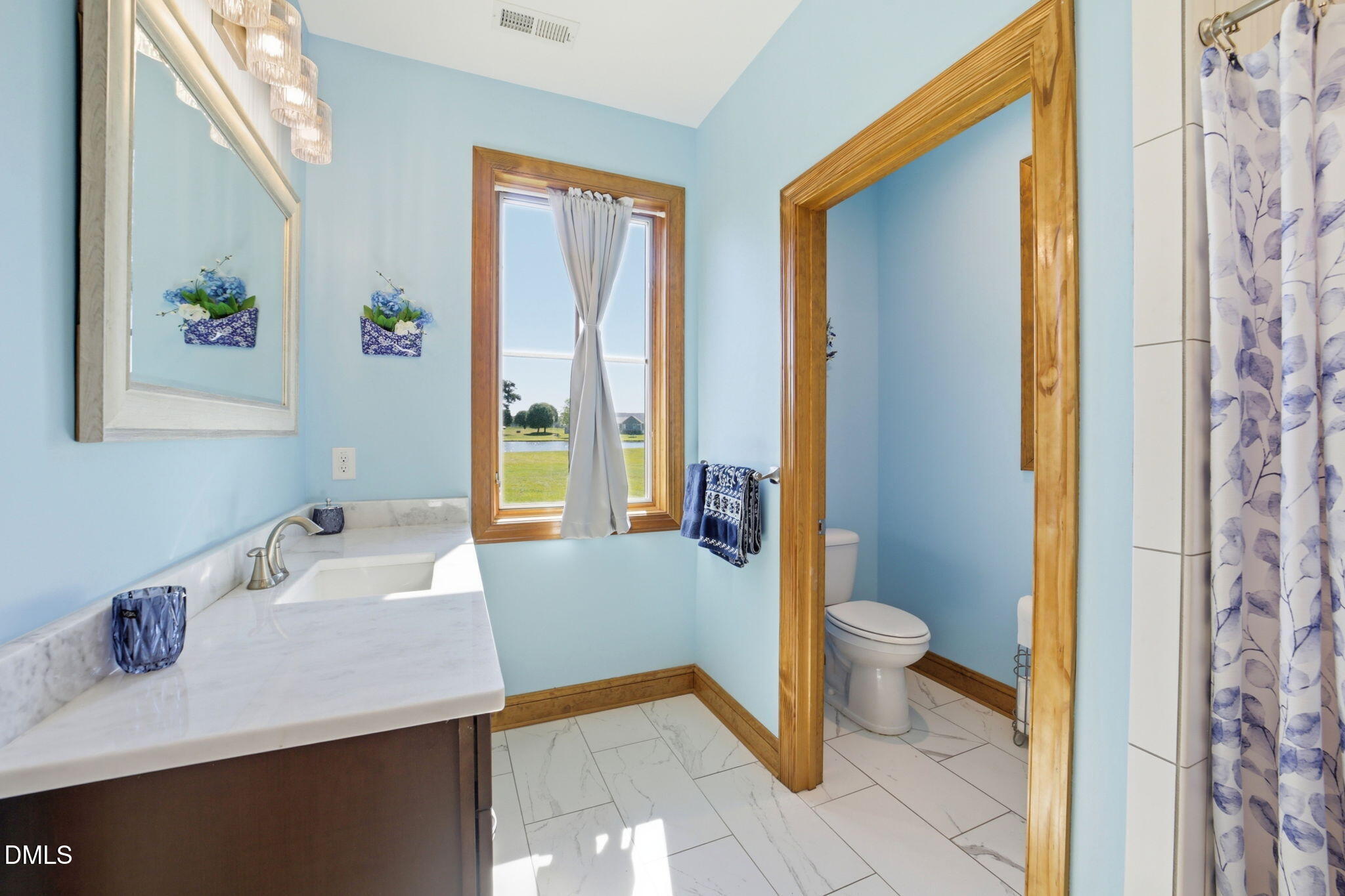 35 North Rippling Court Smithfield, NC 27577 - Photo 28 of 59 a bathroom with a sink a toilet and shower