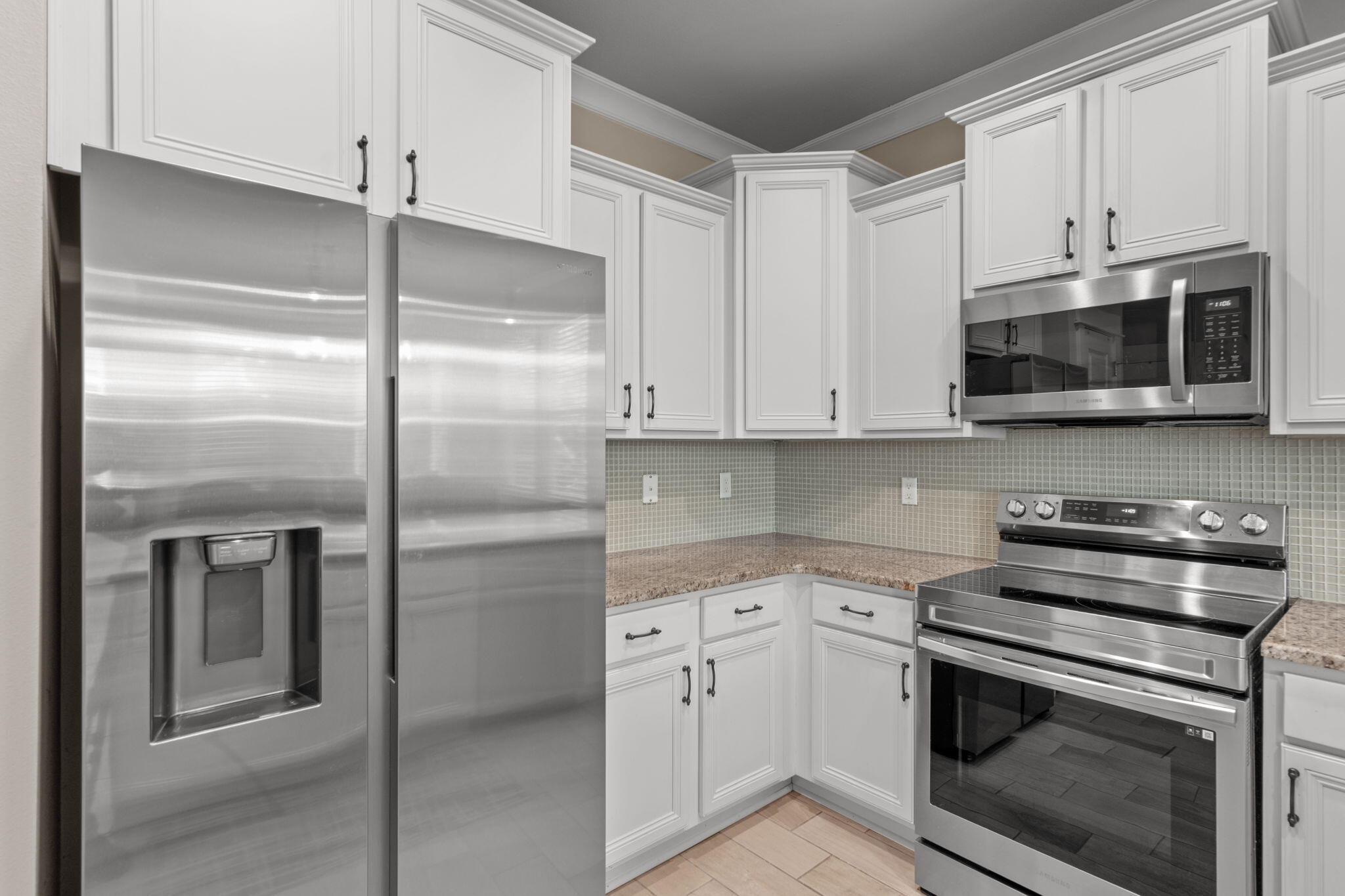 160 Montclair Avenue Santa Rosa Beach, FL 32459 - Photo 11 of 48 a kitchen with stainless steel appliances white cabinets and a stove