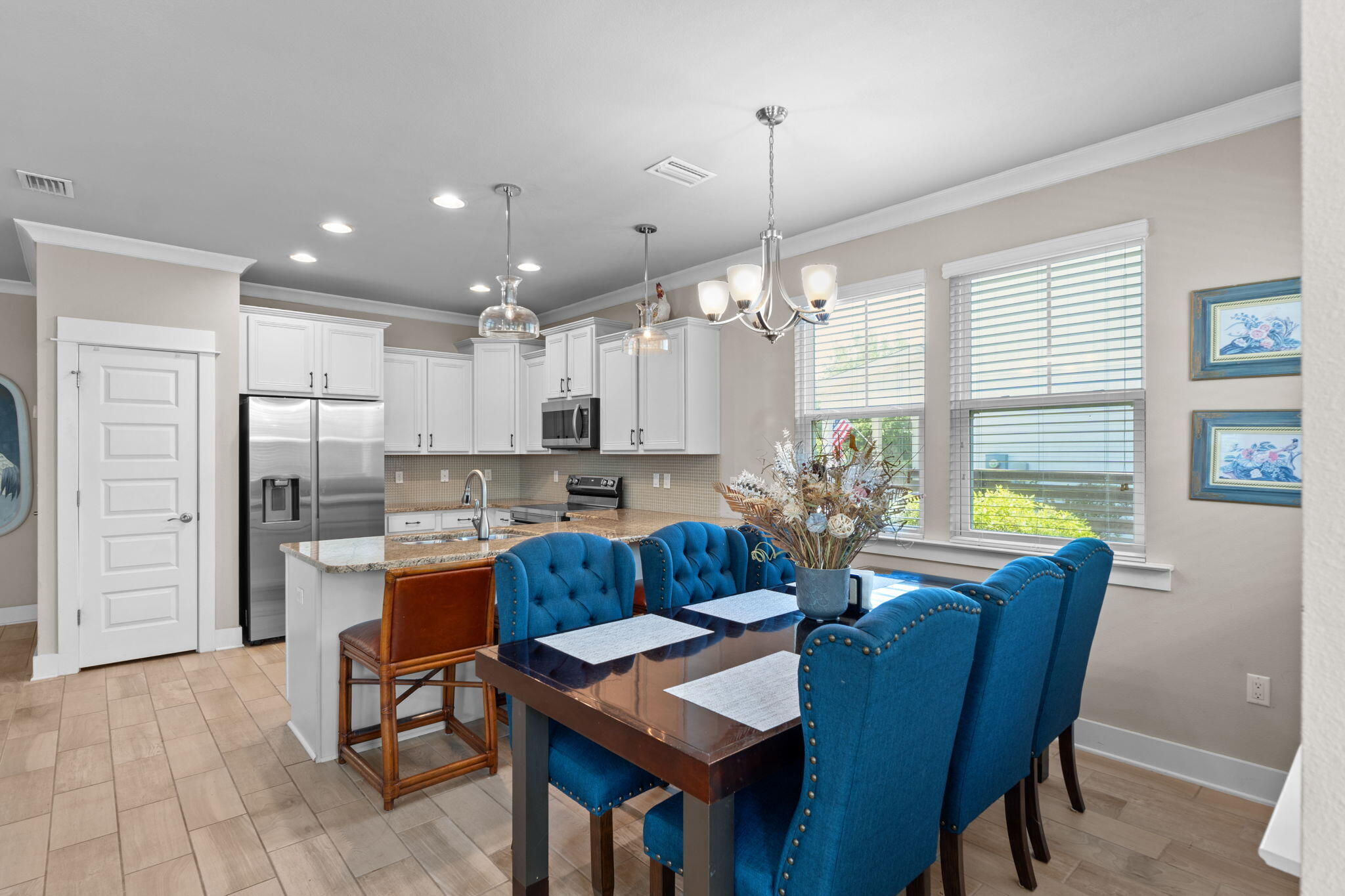 160 Montclair Avenue Santa Rosa Beach, FL 32459 - Photo 12 of 48 a view of a dining room with furniture a chandelier and wooden floor