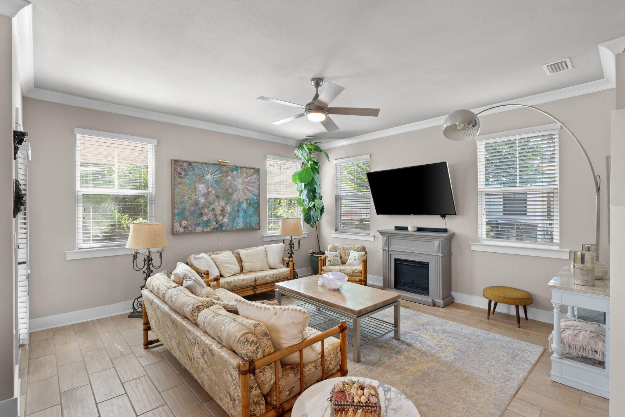 160 Montclair Avenue Santa Rosa Beach, FL 32459 - Photo 15 of 48 a living room with furniture a flat screen tv and a fireplace