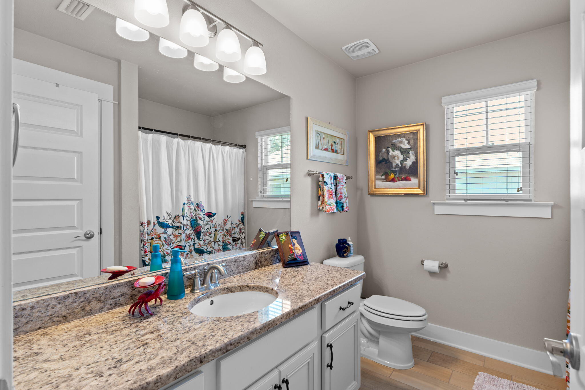 160 Montclair Avenue Santa Rosa Beach, FL 32459 - Photo 27 of 48 a bathroom with a granite countertop sink mirror vanity and toilet