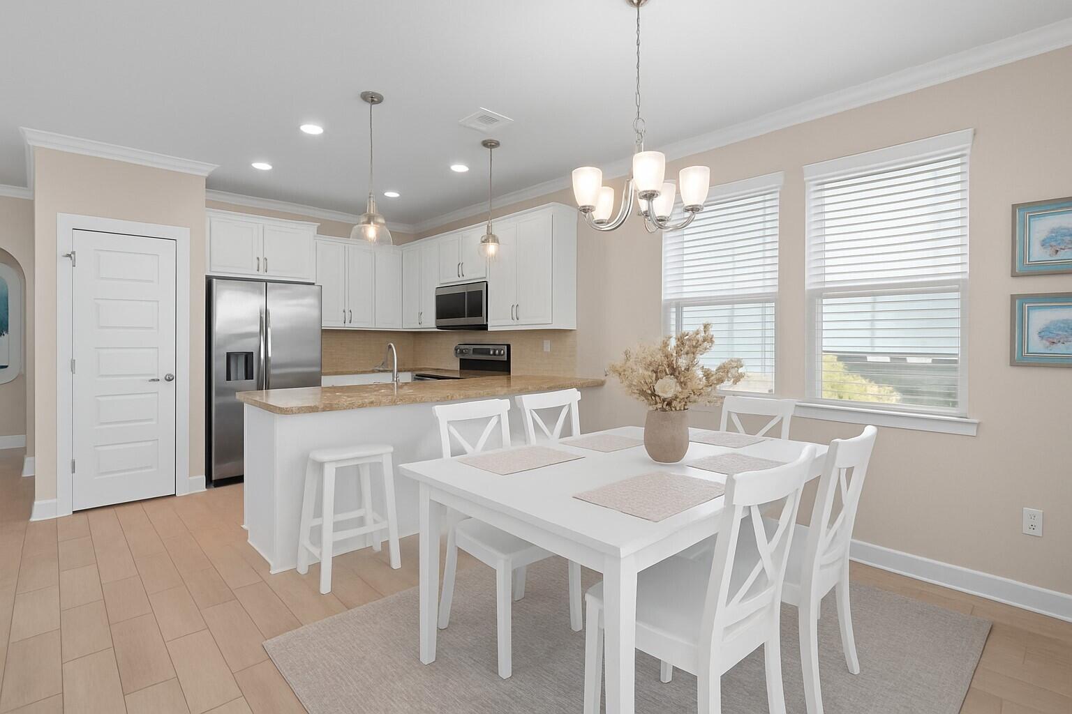 160 Montclair Avenue Santa Rosa Beach, FL 32459 - Photo 5 of 48 a dining room filled chandelier and kitchen view