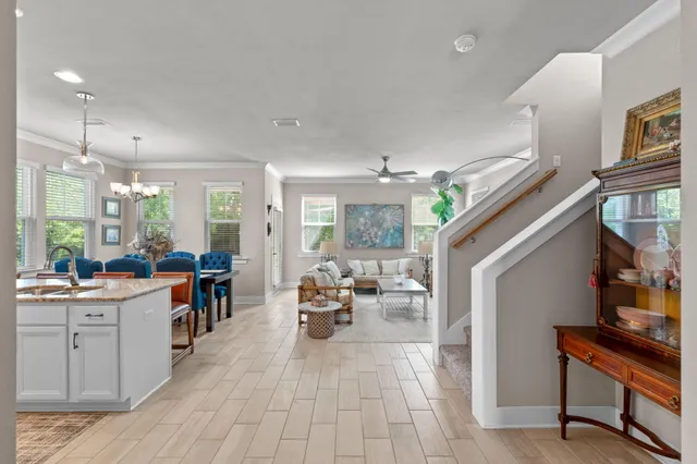 a kitchen with stainless steel appliances granite countertop a sink refrigerator and cabinets