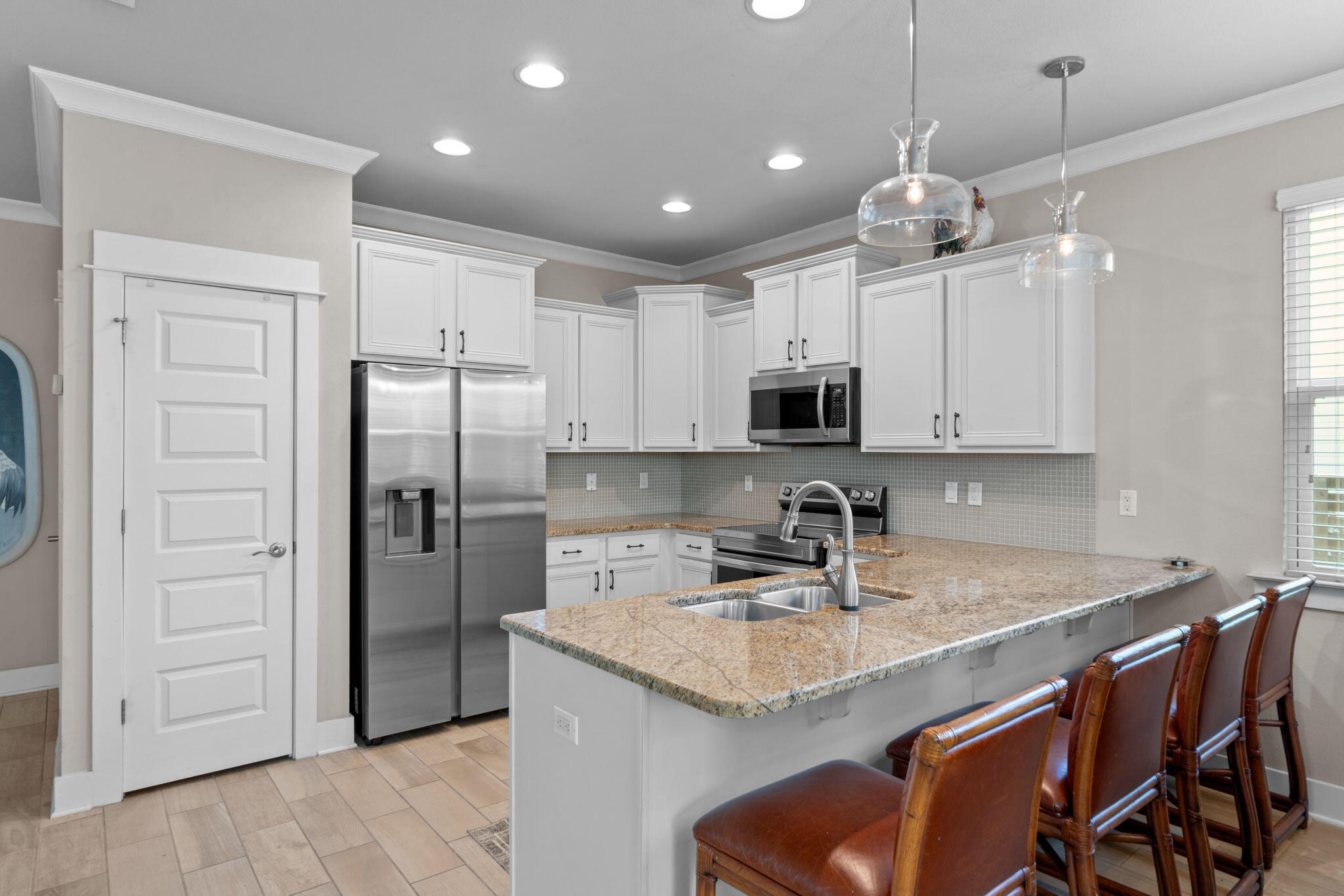 160 Montclair Avenue Santa Rosa Beach, FL 32459 - Photo 9 of 48 a kitchen with stainless steel appliances granite countertop a sink refrigerator and cabinets