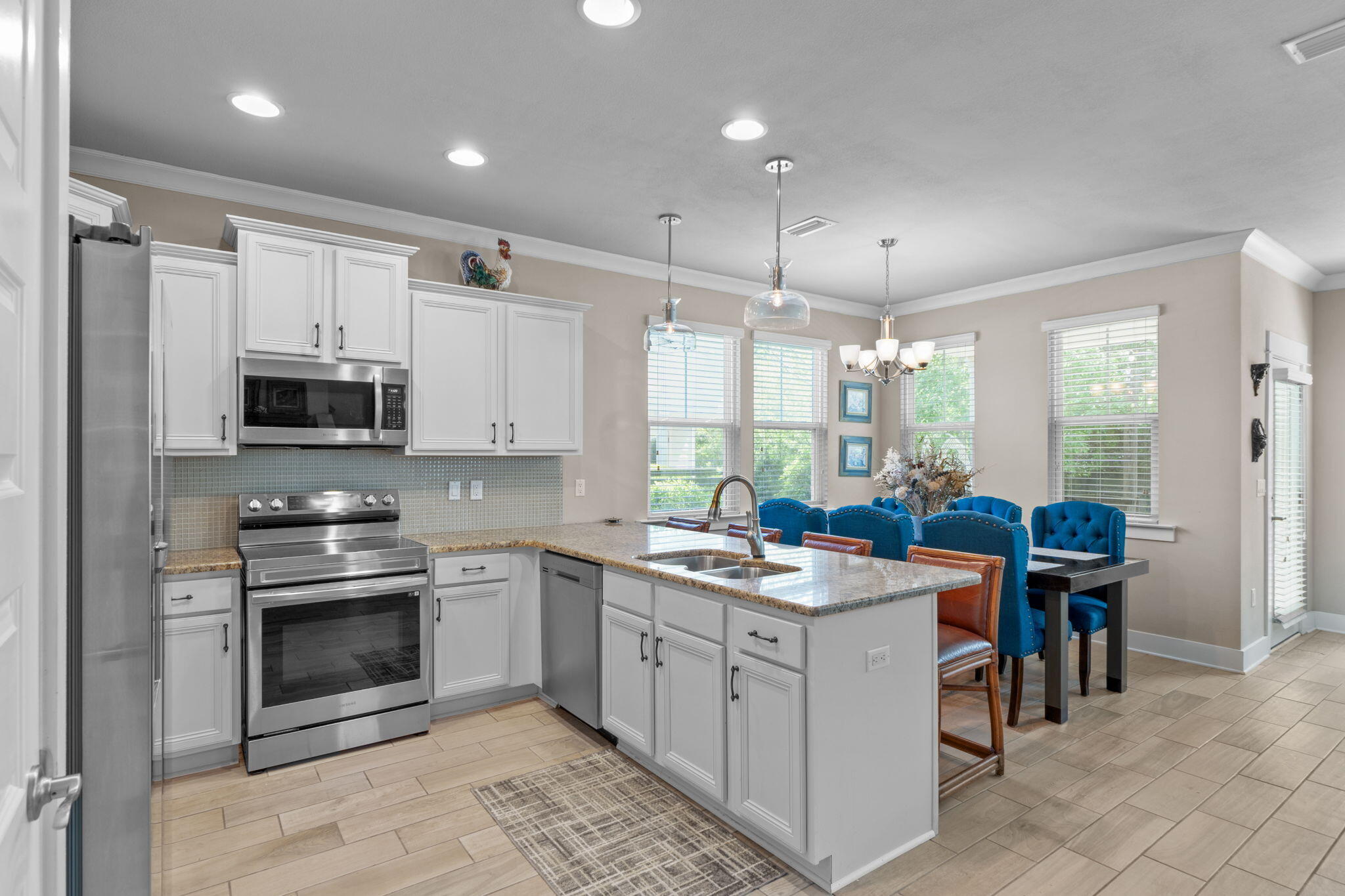 160 Montclair Avenue Santa Rosa Beach, FL 32459 - Photo 10 of 48 a kitchen that has a lot of cabinets in it and appliances
