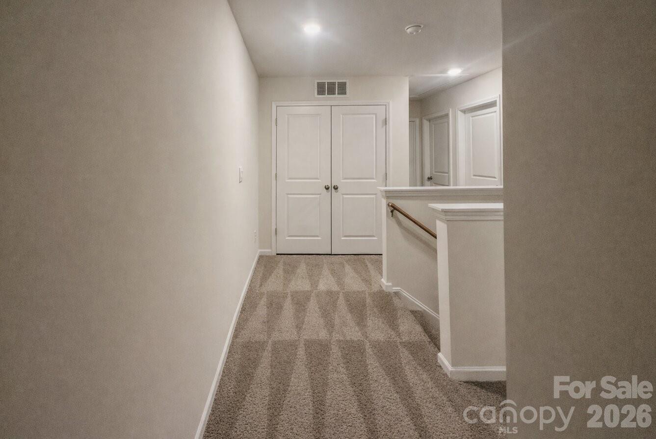6109 Faron Way Charlotte, NC 28262 - Photo 13 of 23 a view of a hallway with closet
