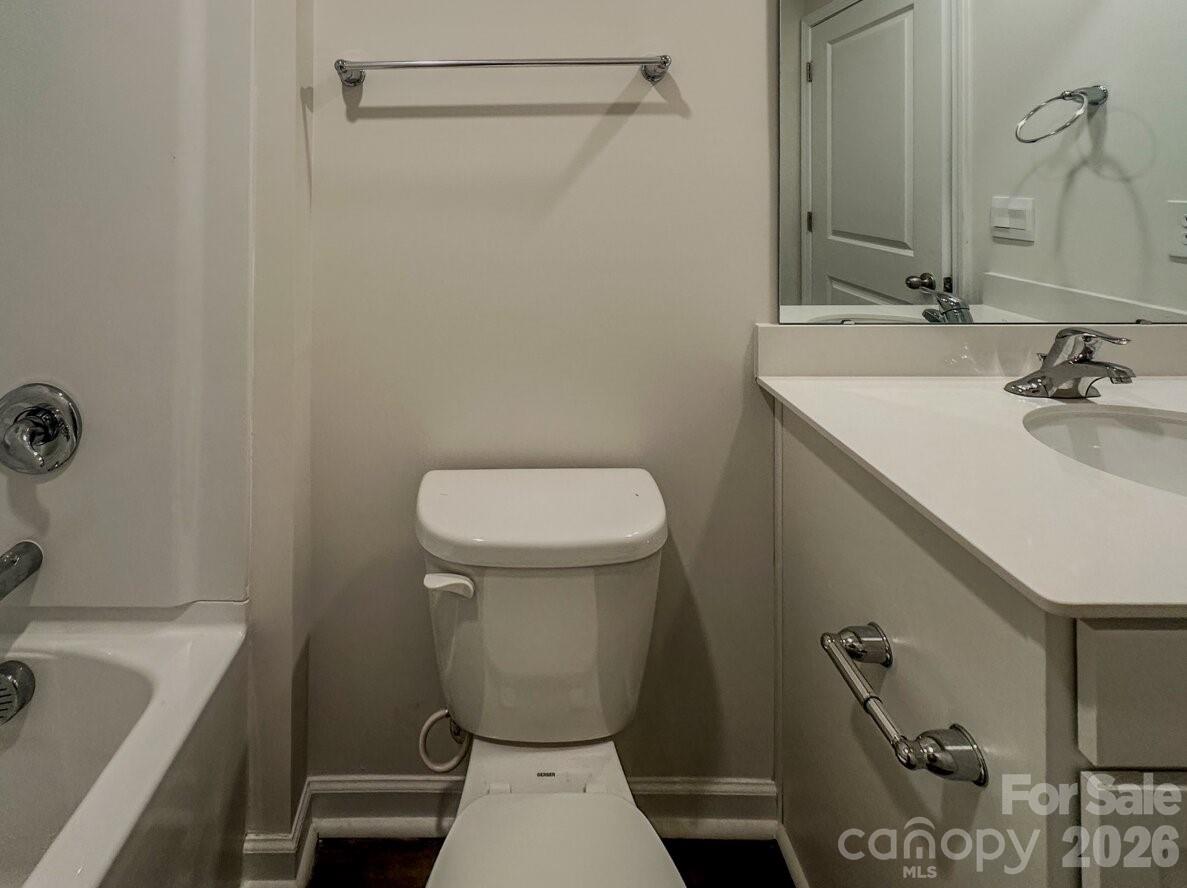 6109 Faron Way Charlotte, NC 28262 - Photo 16 of 23 a bathroom with a sink a toilet and shower
