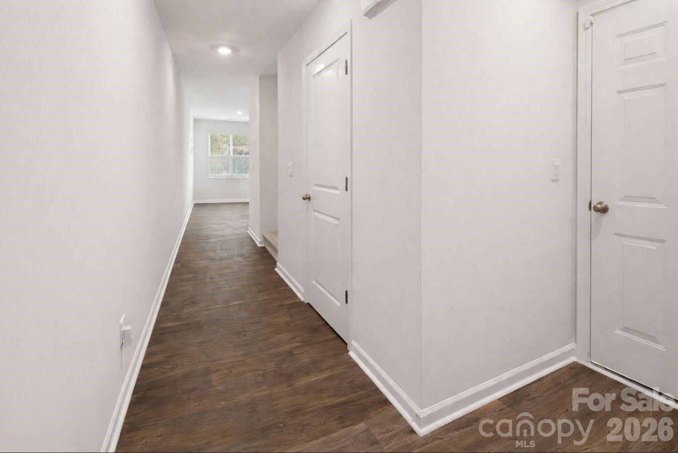 6109 Faron Way Charlotte, NC 28262 - Photo 2 of 23 a view of a hallway with wooden floor