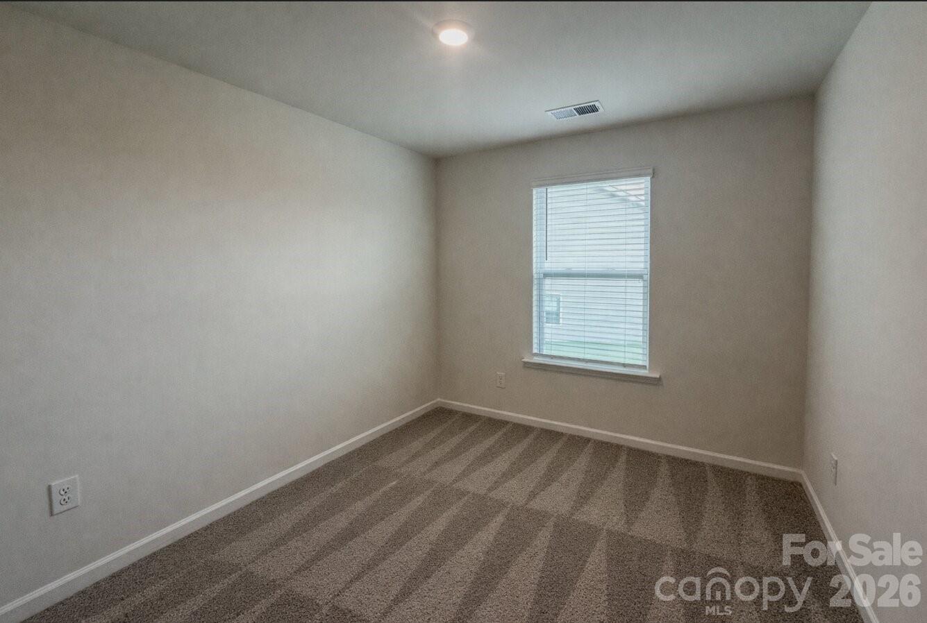 6109 Faron Way Charlotte, NC 28262 - Photo 21 of 23 an empty room with a window