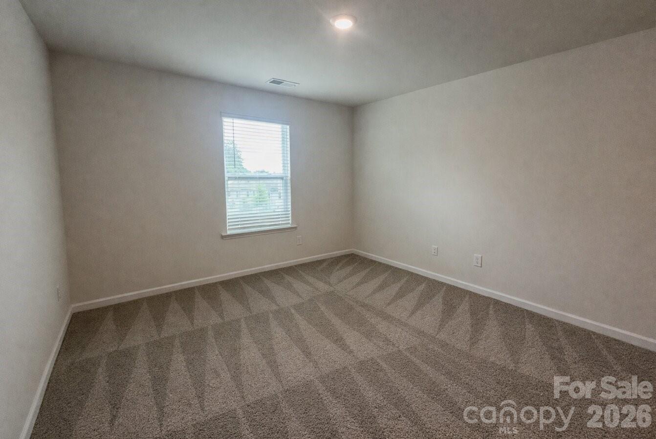 6109 Faron Way Charlotte, NC 28262 - Photo 22 of 23 an empty room with a window