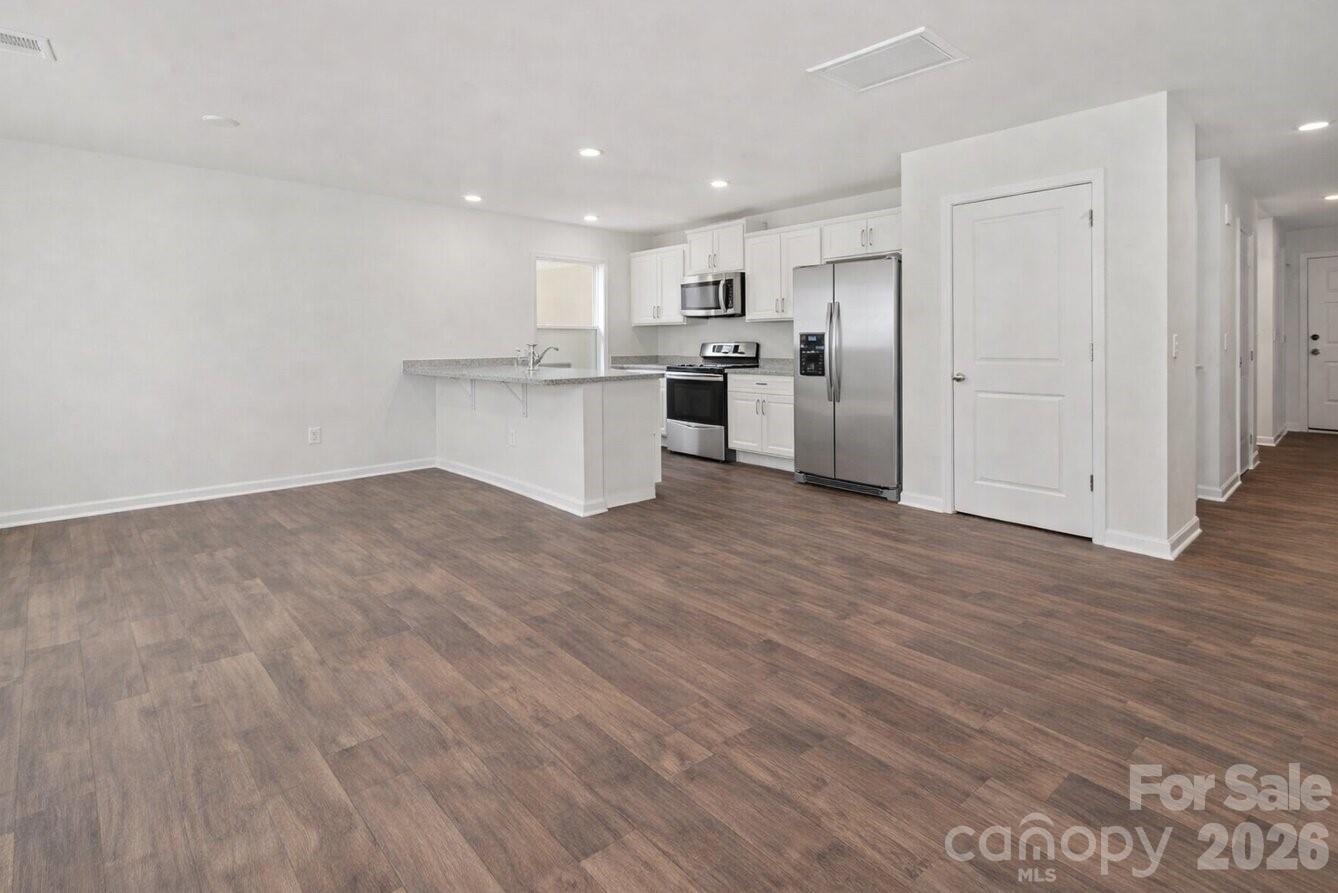 6109 Faron Way Charlotte, NC 28262 - Photo 3 of 23 a view of kitchen with wooden floor