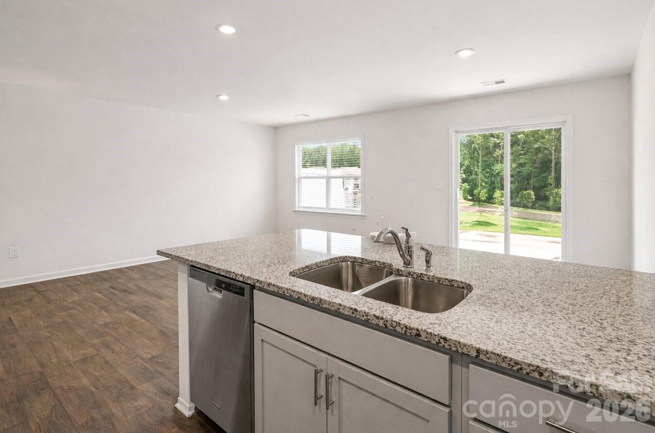 6109 Faron Way Charlotte, NC 28262 - Photo 6 of 23 a kitchen with a sink and cabinets