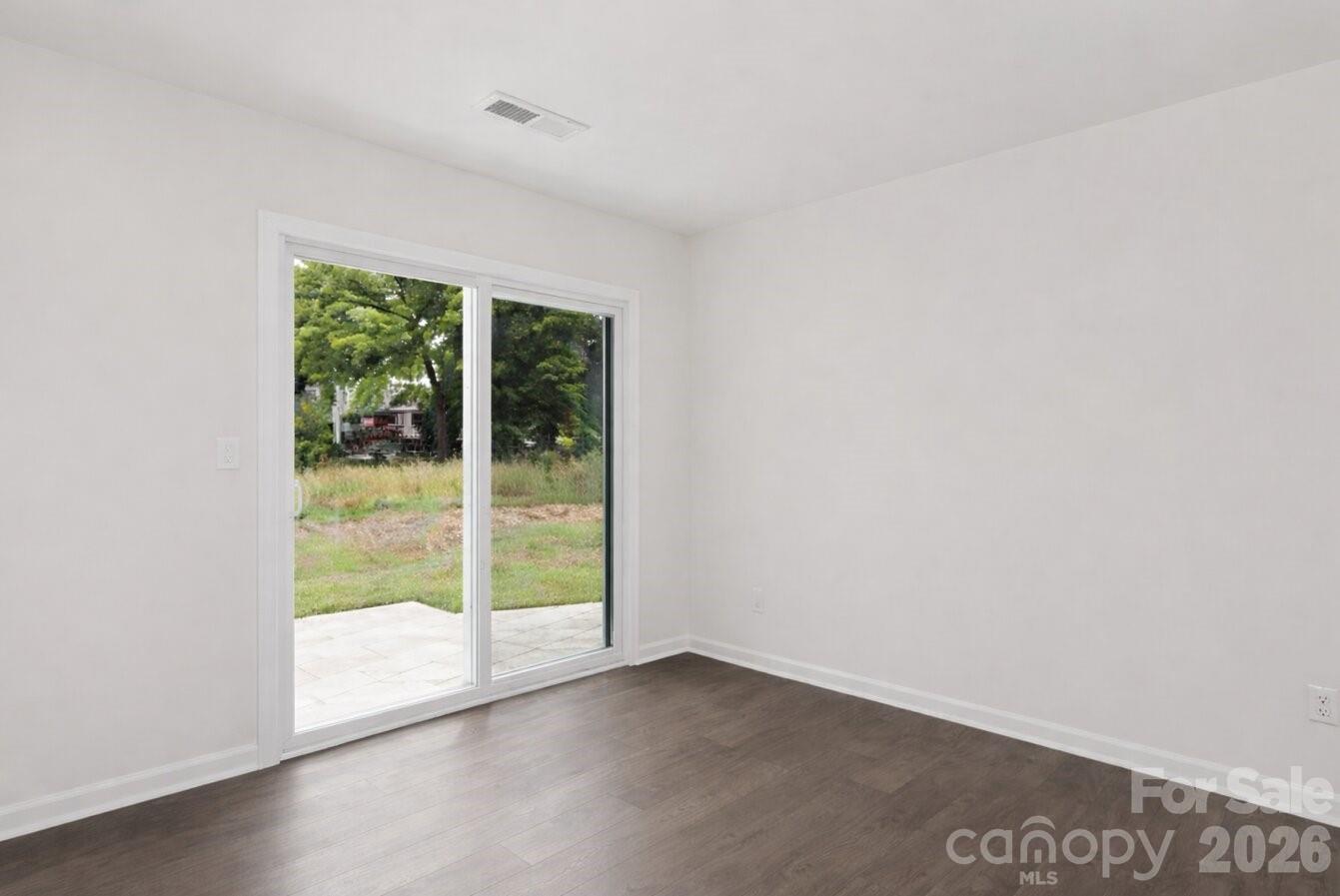 6109 Faron Way Charlotte, NC 28262 - Photo 8 of 23 a view of an empty room with a window