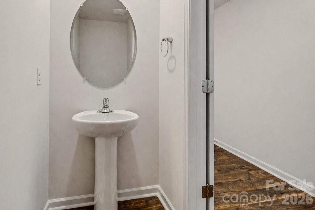 6109 Faron Way Charlotte, NC 28262 - Photo 10 of 23 a bathroom with a sink and a mirror