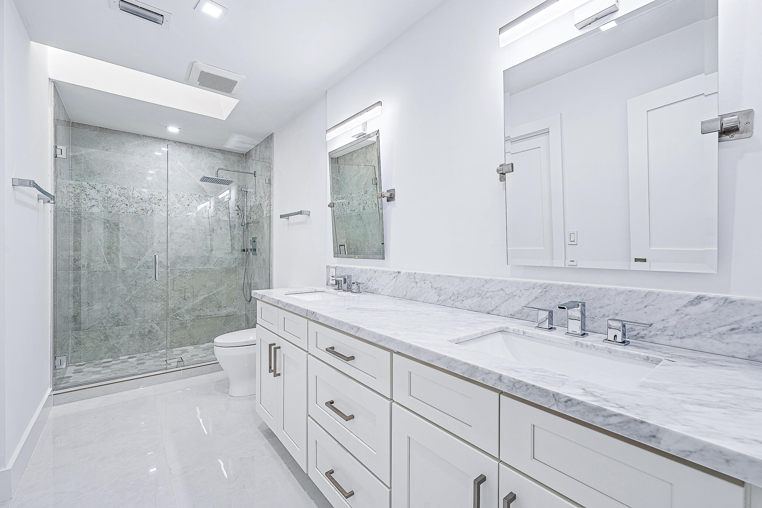 Undisclosed Address Jupiter, FL 33477 - Photo 17 of 30 a bathroom with a granite countertop sink mirror and toilet