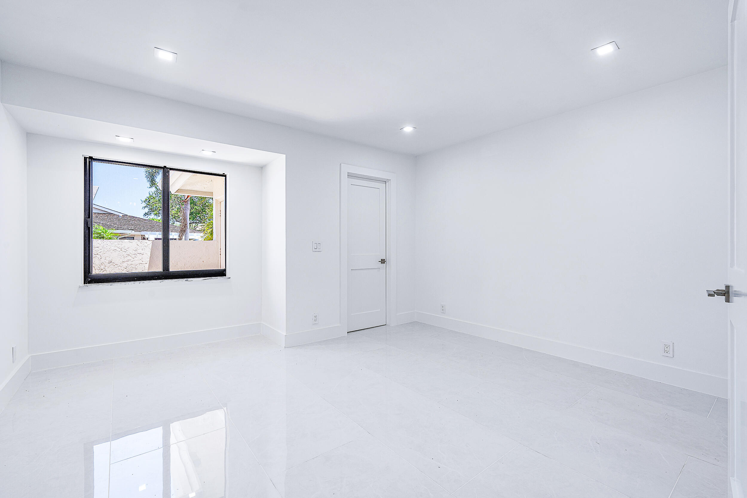 Undisclosed Address Jupiter, FL 33477 - Photo 18 of 30 an empty room with windows