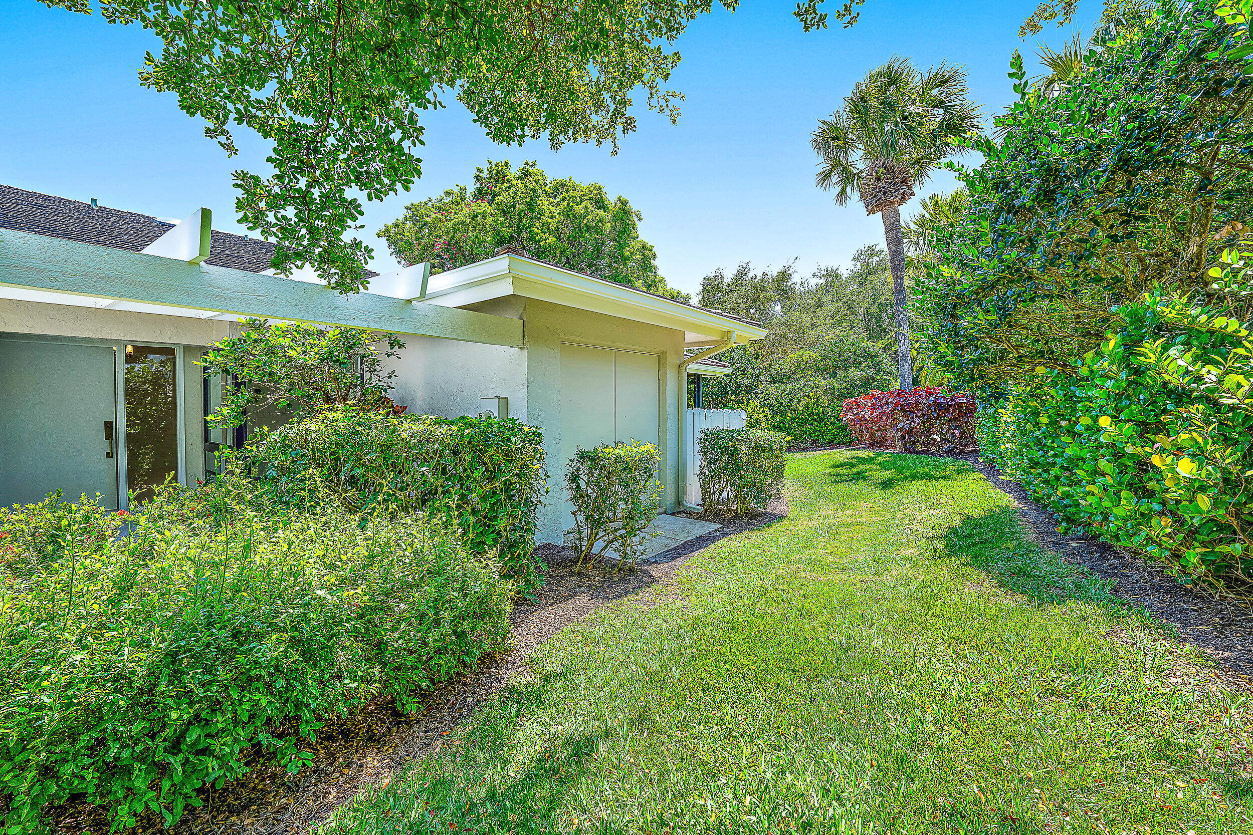 Undisclosed Address Jupiter, FL 33477 - Photo 21 of 30 front view of a house with a yard