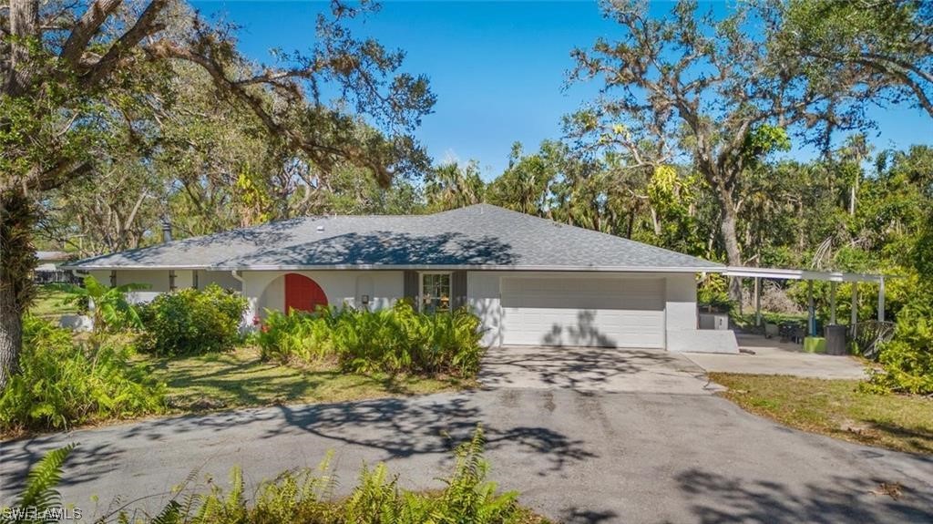 13951 River Road Fort Myers, FL 33905 - Photo 1 of 34 front view of a house with a yard