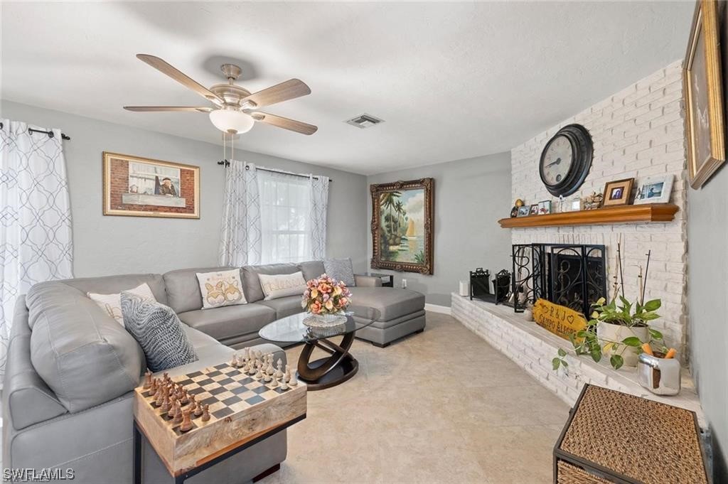 13951 River Road Fort Myers, FL 33905 - Photo 2 of 34 a living room with furniture a rug and a window