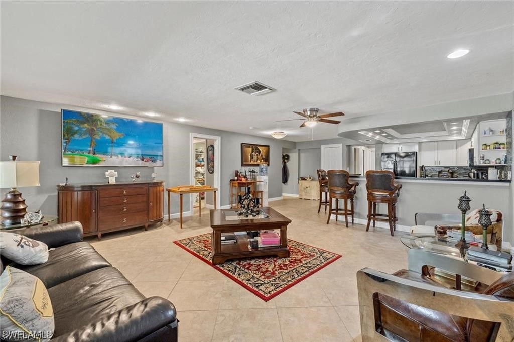 13951 River Road Fort Myers, FL 33905 - Photo 7 of 34 a living room with furniture and wooden floor