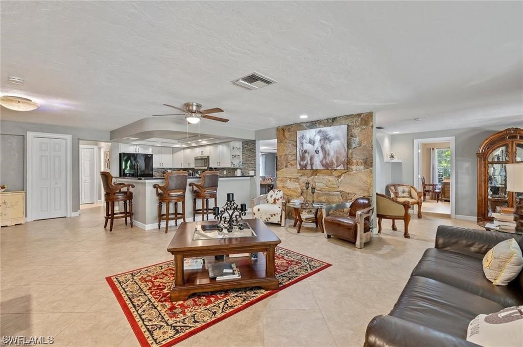 13951 River Road Fort Myers, FL 33905 - Photo 8 of 34 a living room with furniture and wooden floor