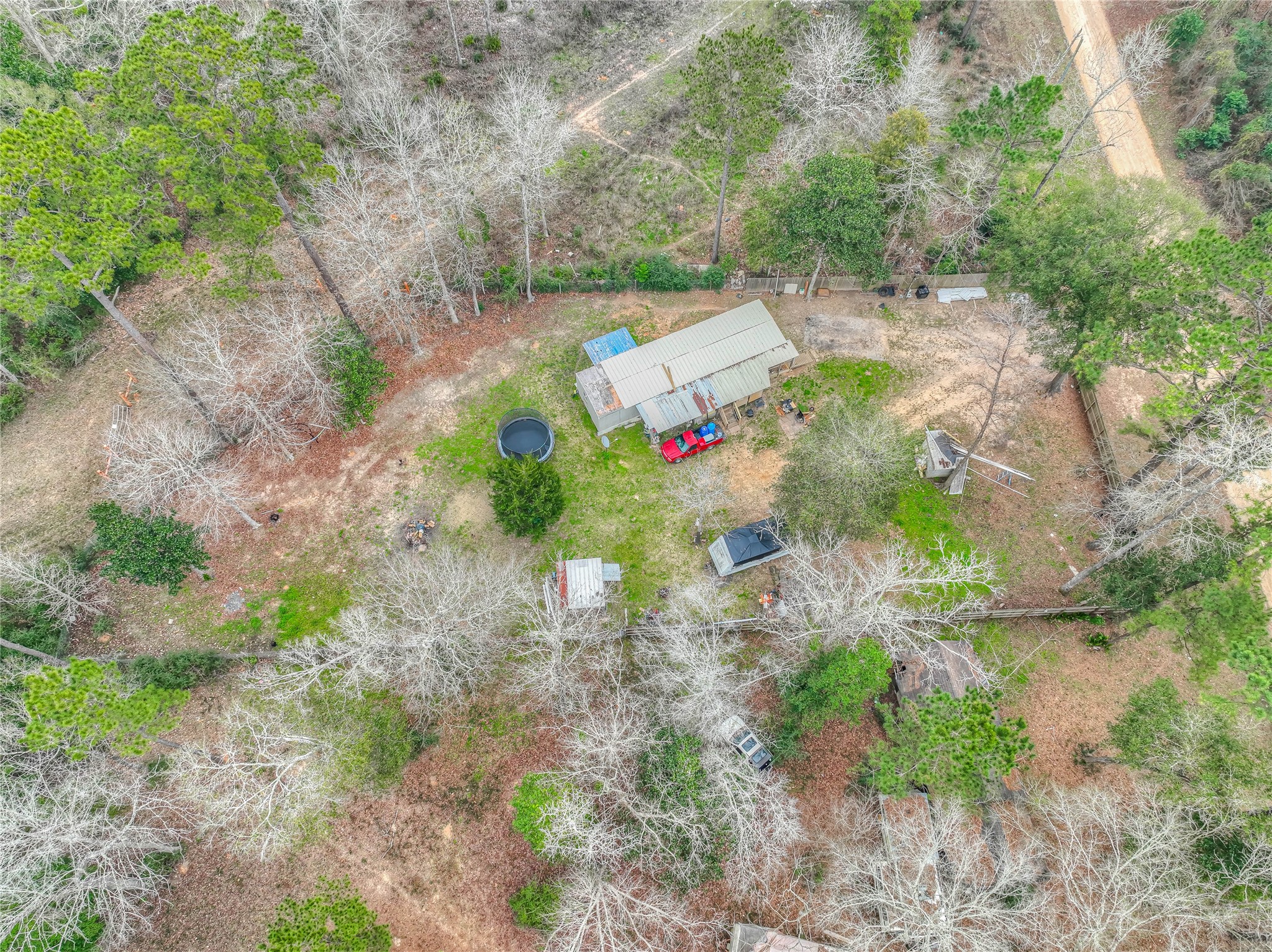 713 Garrett Road Livingston, TX 77351 - Photo 2 of 40 a view of yard with green space