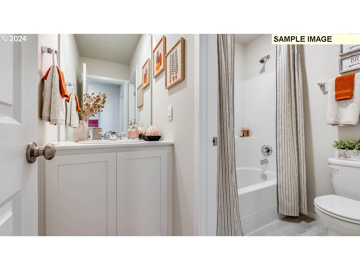 812 Northwest 175th Street Ridgefield, WA 98642 - Photo 15 of 25 a bathroom with a sink and a mirror