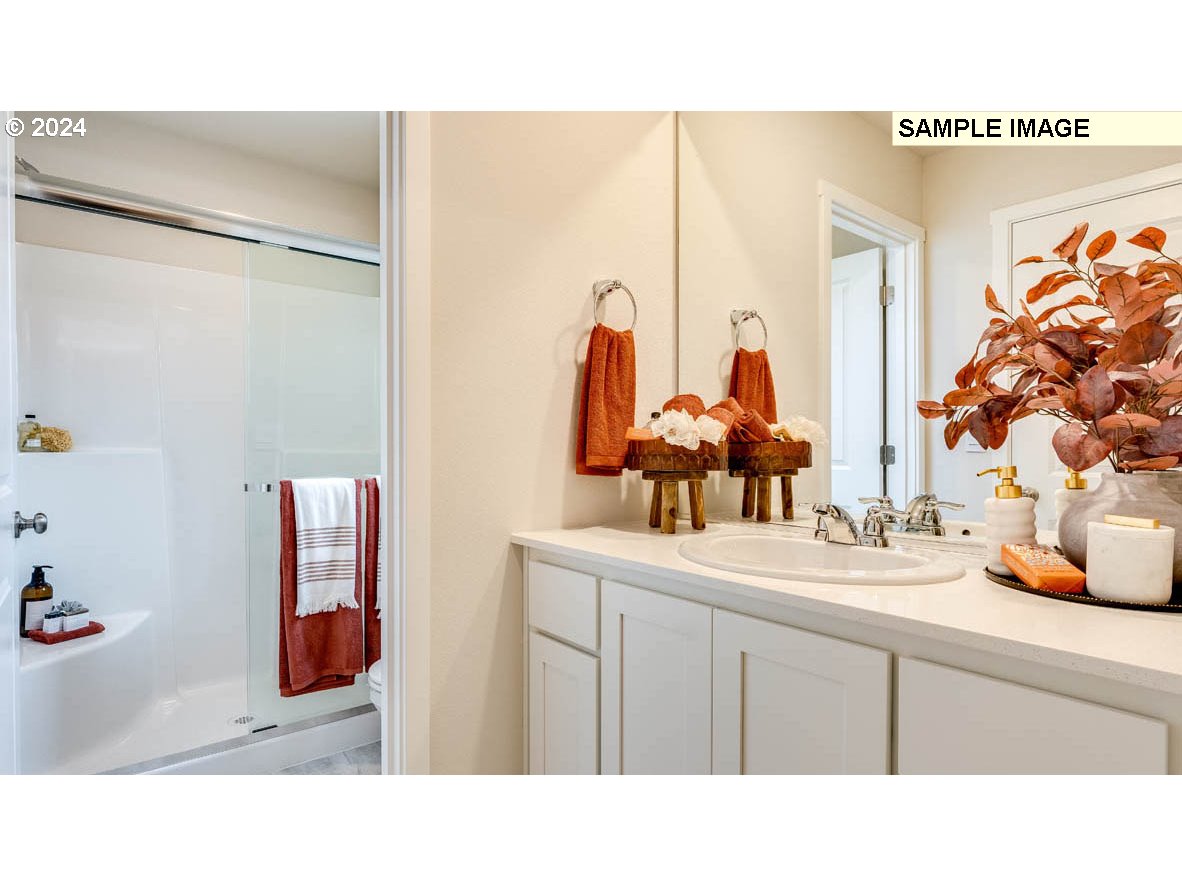 812 Northwest 175th Street Ridgefield, WA 98642 - Photo 21 of 25 a bathroom with a sink mirror and vanity