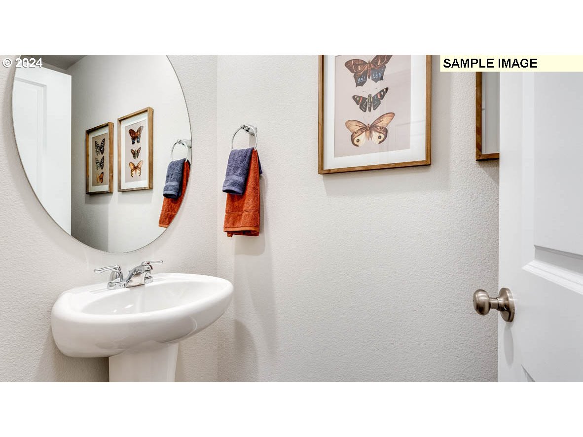 812 Northwest 175th Street Ridgefield, WA 98642 - Photo 4 of 25 a bathroom with a sink and a mirror