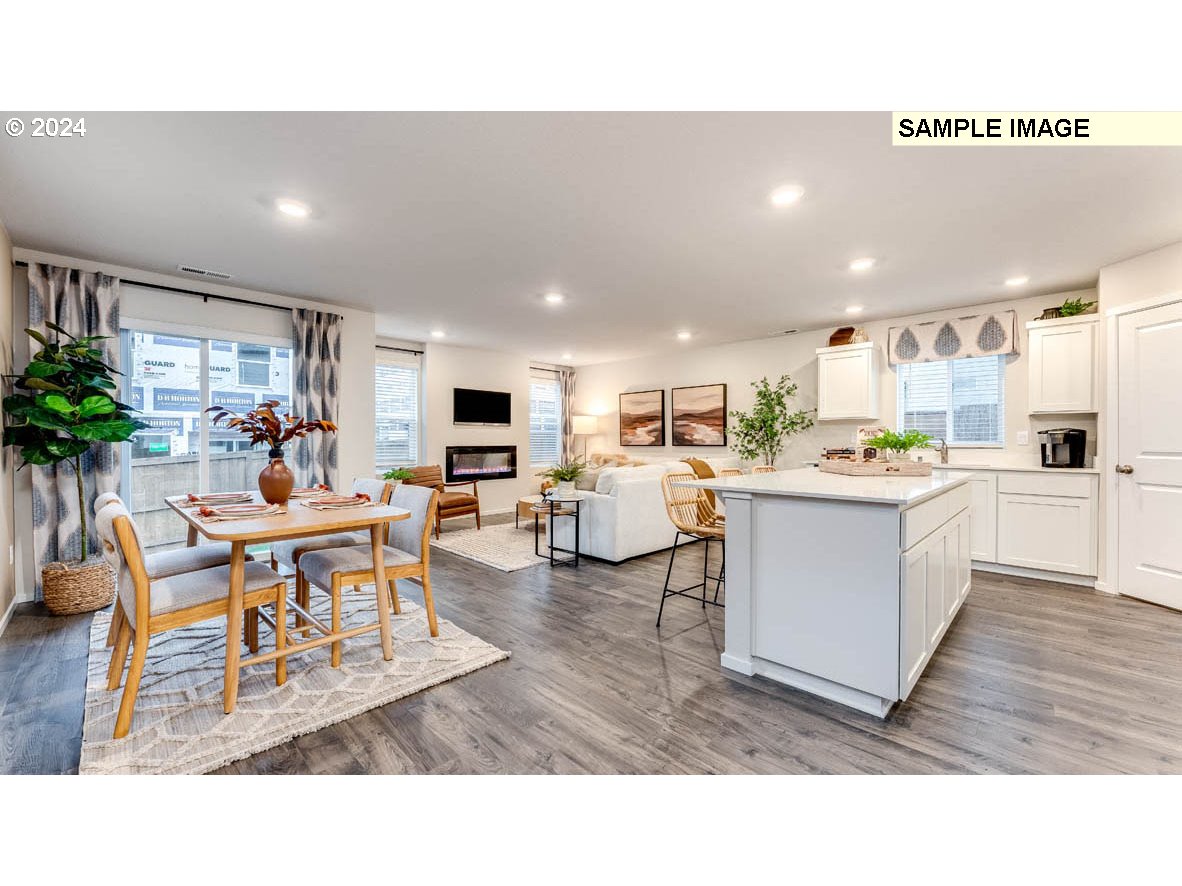 812 Northwest 175th Street Ridgefield, WA 98642 - Photo 6 of 25 a living room with lots of furniture and kitchen view