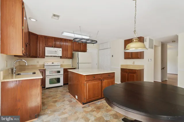 a view of an empty room with windows