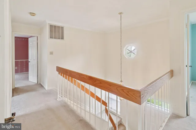 a bathroom with a granite countertop tub sink and mirror