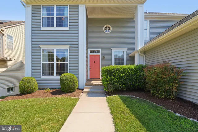 a view of an entryway with wooden floor and stairs