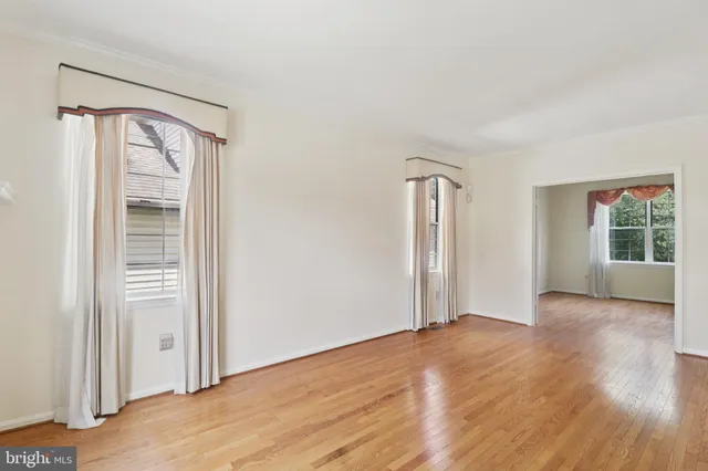 a view of a hallway view with wooden floor and staircase