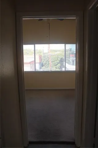 a kitchen with stainless steel appliances a refrigerator and a stove