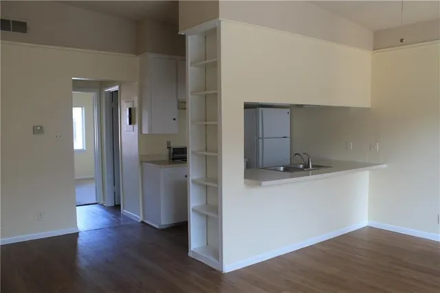 a view of parking garage with cars parked