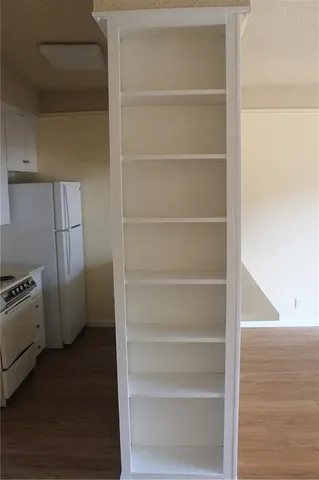 a view of storage and utility room with empty racks
