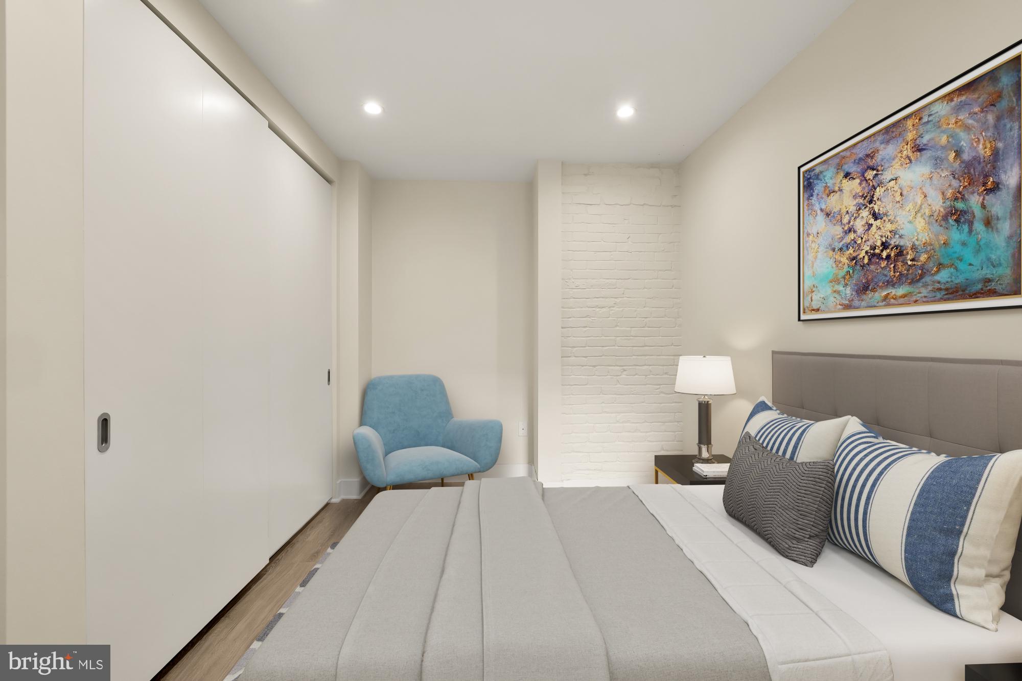 58 T Street Northwest, Unit 1 Washington, DC 20001 - Photo 11 of 27 a bedroom with a bed and a painting on the wall