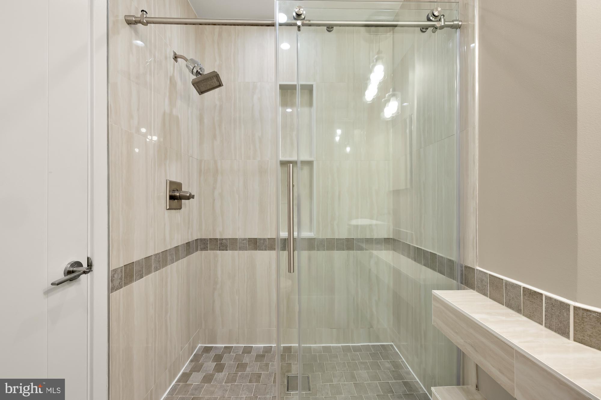 58 T Street Northwest, Unit 1 Washington, DC 20001 - Photo 14 of 27 a bathroom with a glass shower door