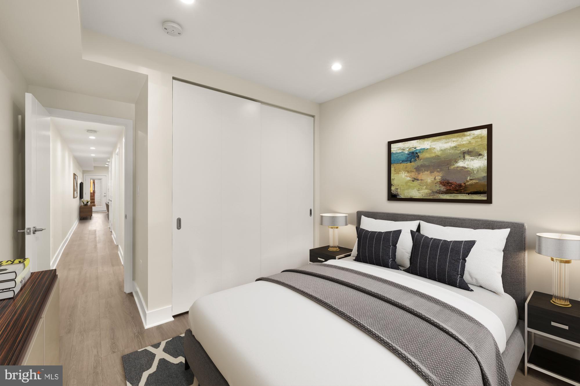 58 T Street Northwest, Unit 1 Washington, DC 20001 - Photo 16 of 27 a bedroom with a bed and a painting on the wall