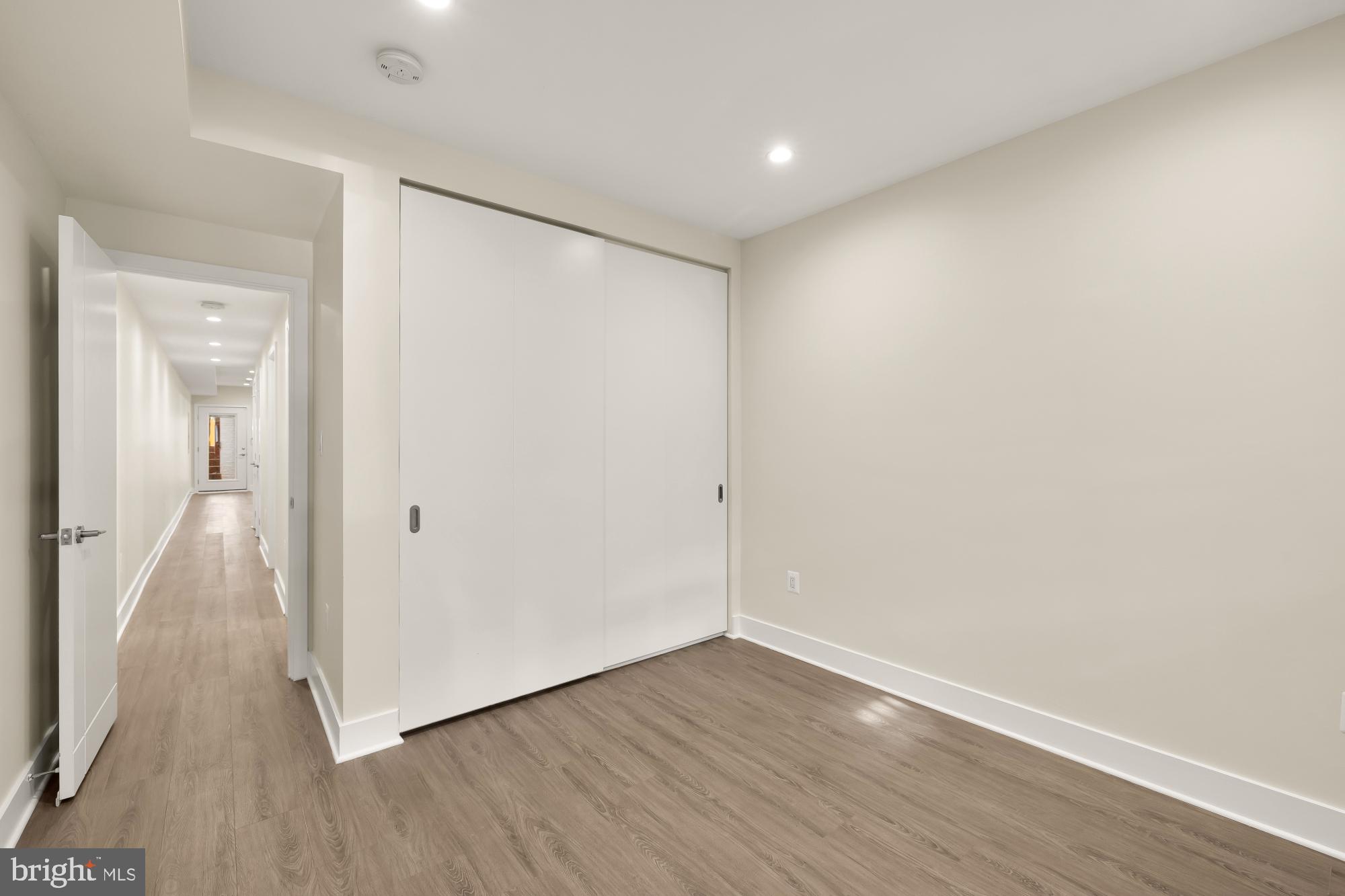 58 T Street Northwest, Unit 1 Washington, DC 20001 - Photo 18 of 27 a view of an empty room with wooden floor