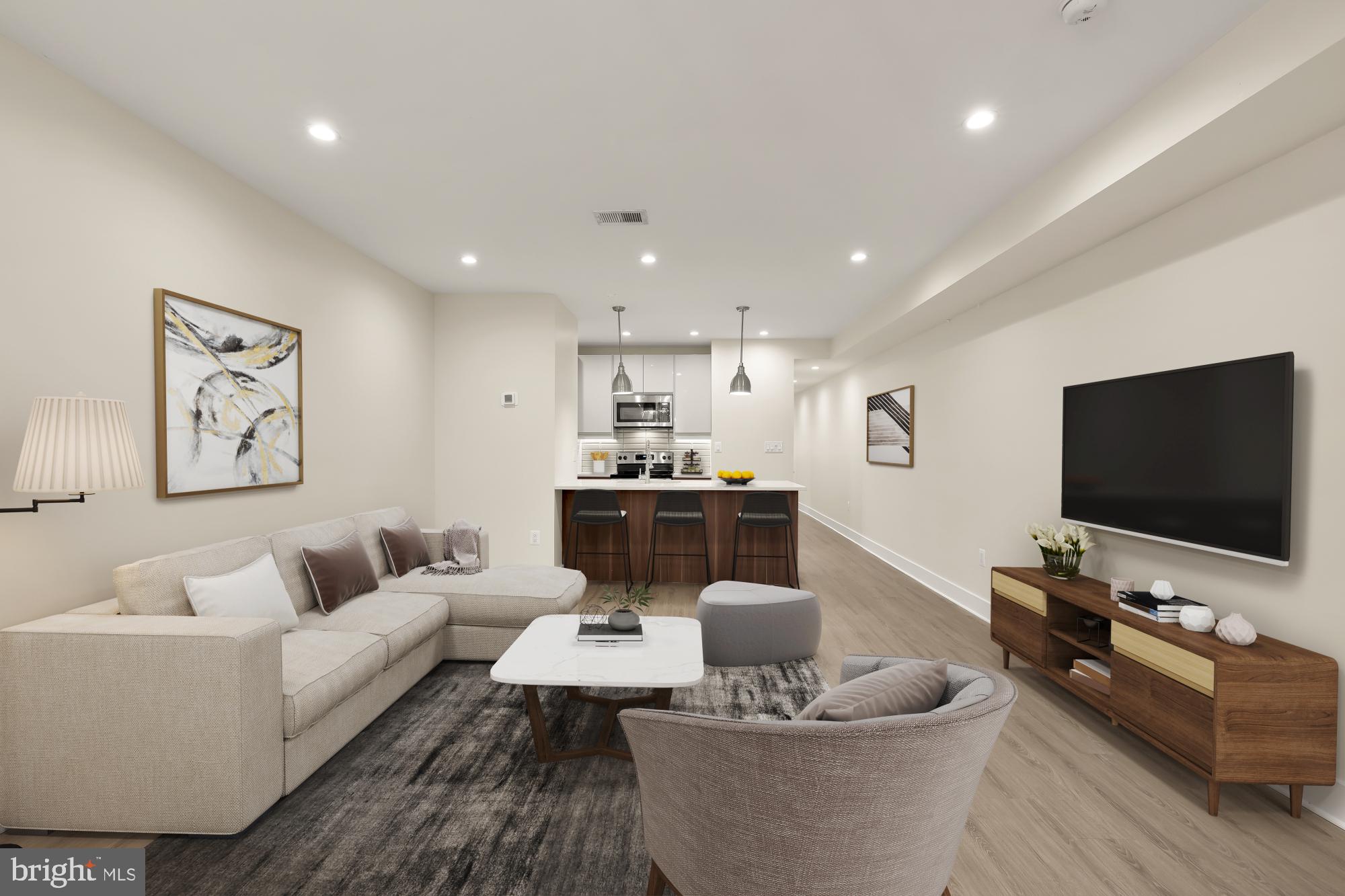 58 T Street Northwest, Unit 1 Washington, DC 20001 - Photo 2 of 27 a living room with furniture and a flat screen tv